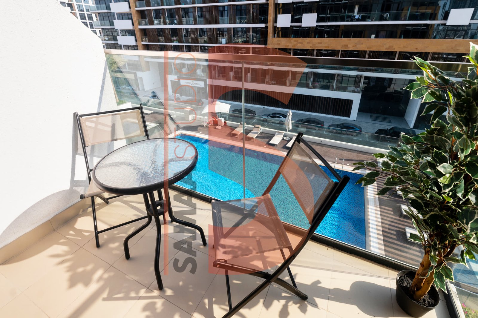 UAE apartment balcony with pool view